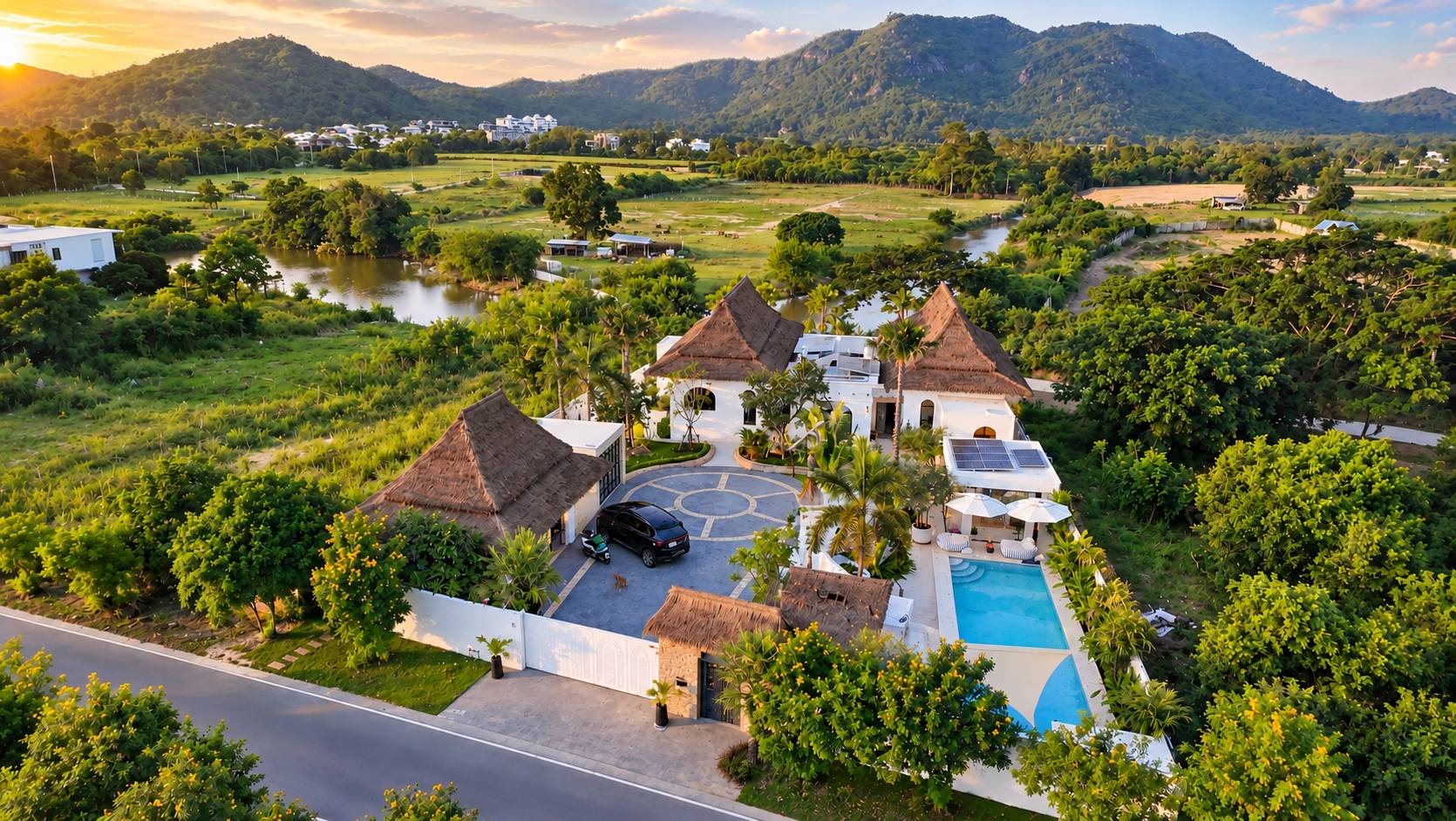 Aerial overview of the Casa Maya estate, pool and mountain setting